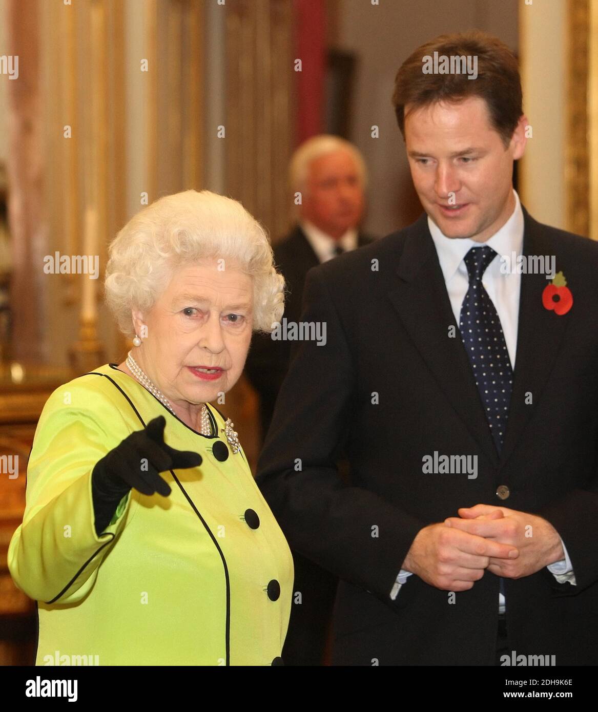 File photo dated 11/11/2010 of Queen Elizabeth II speaks to Nick Clegg at the annual Civil Service Awards Reception, at Buckingham Palace, London. The Queen's weekly audience with the Prime Minister was postponed this week to allow Boris Johnson to focus on the race against the clock to secure a post-Brexit trade agreement. Stock Photo