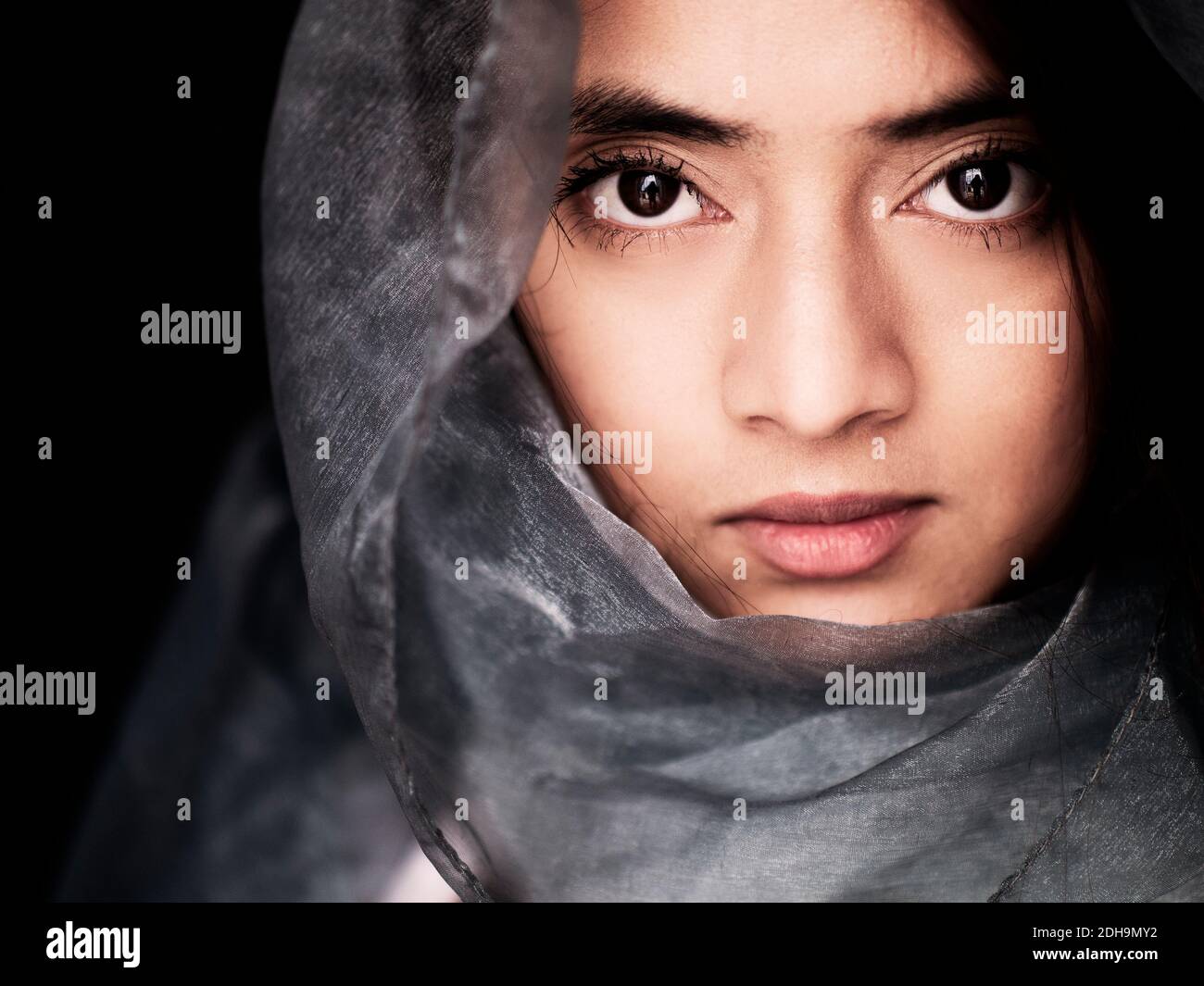 Beautiful young Nepalese woman wearing a scarf on her head Stock Photo