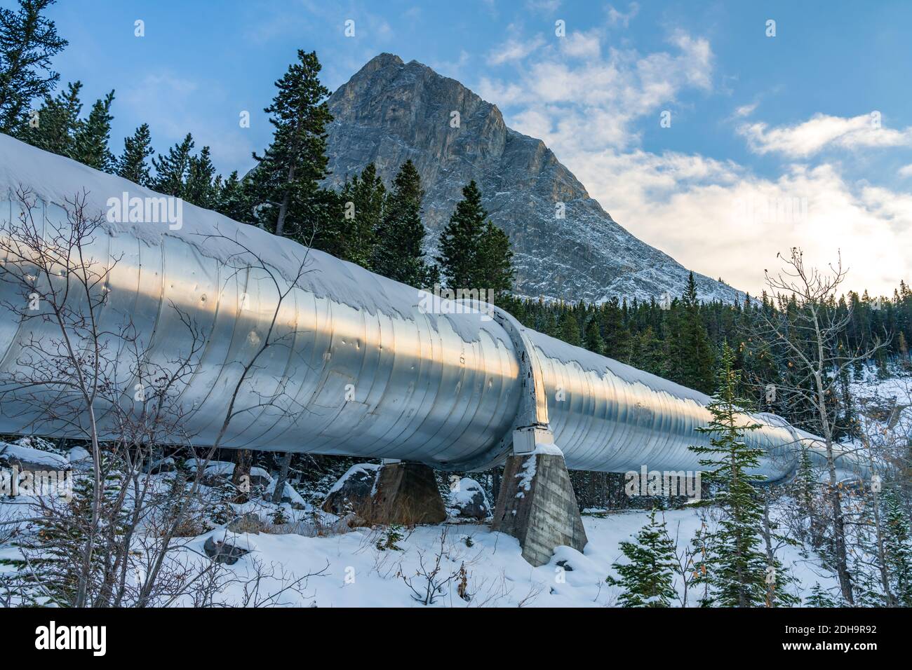 Big pipeline in Grassi Lakes hiking trail connects Whitemans Pond and Rundle Forebay. Hydro power system in Canmore, Alberta, Canada. Stock Photo