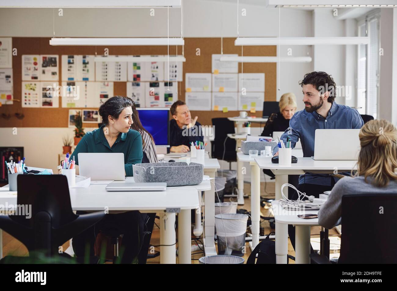 Creative professionals working in office Stock Photo