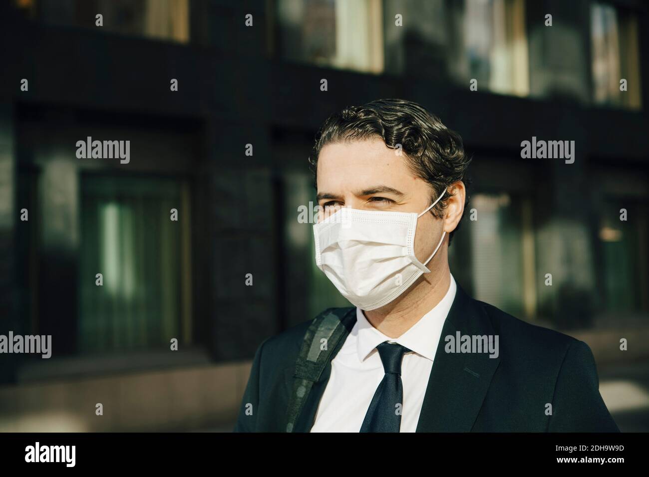 Businessman with face mask Stock Photo