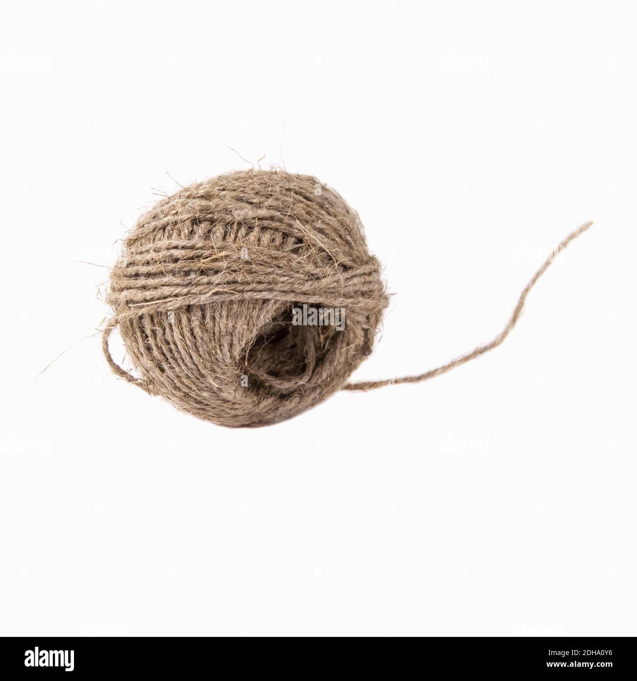 Ball of Strong Brown String Over White Background Stock Photo
