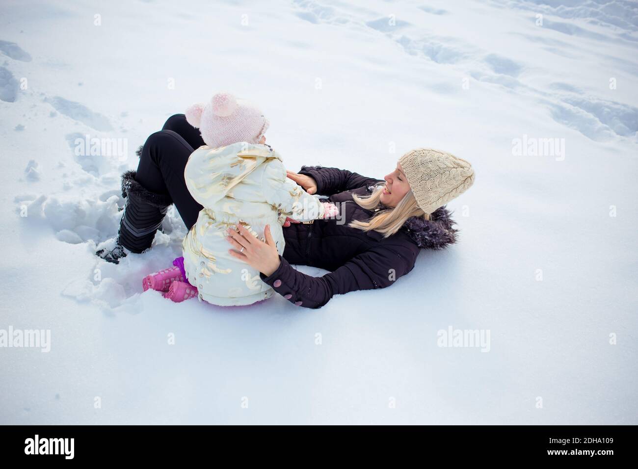 Happy family, mom with son and daughter in winter clothing, winter time Stock Photo