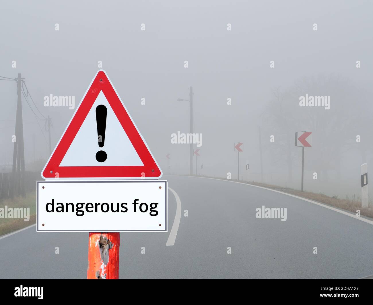 Dangerous Fog Warning Sign in Road Traffic Stock Photo