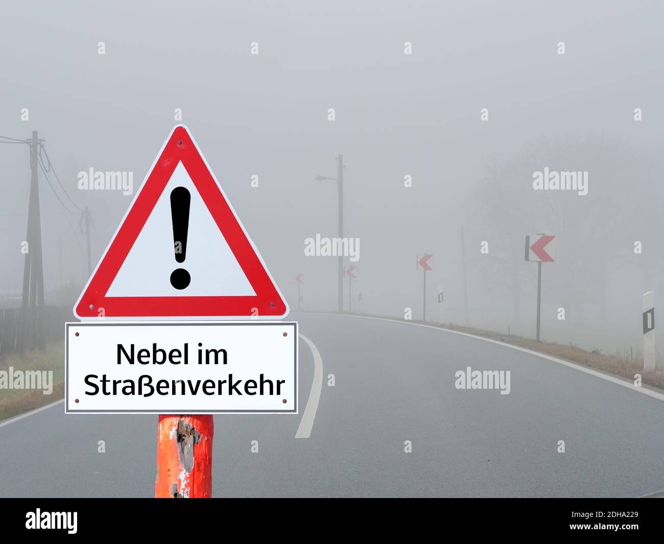 Fog warning sign in road traffic in german Stock Photo
