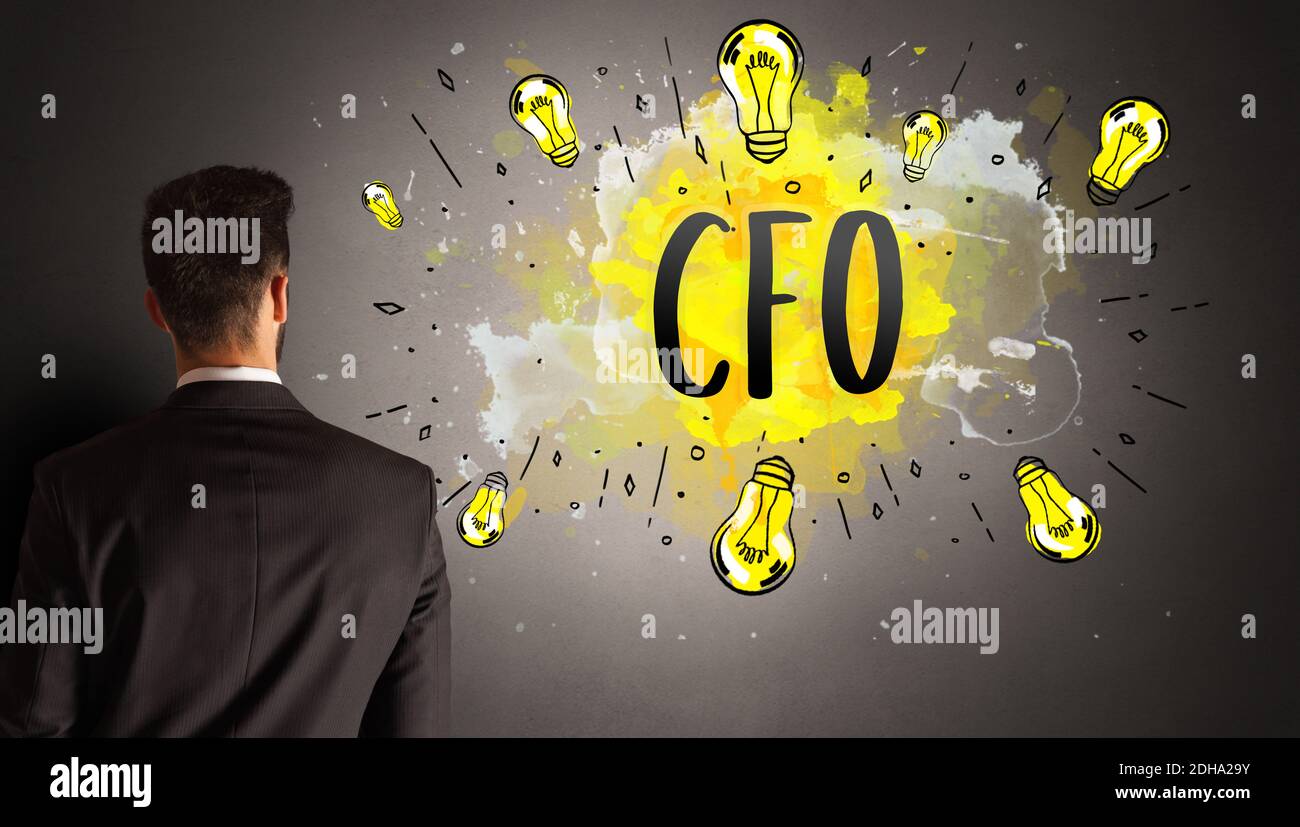businessman drawing colorful light bulb with CFO abbreviation, new ...