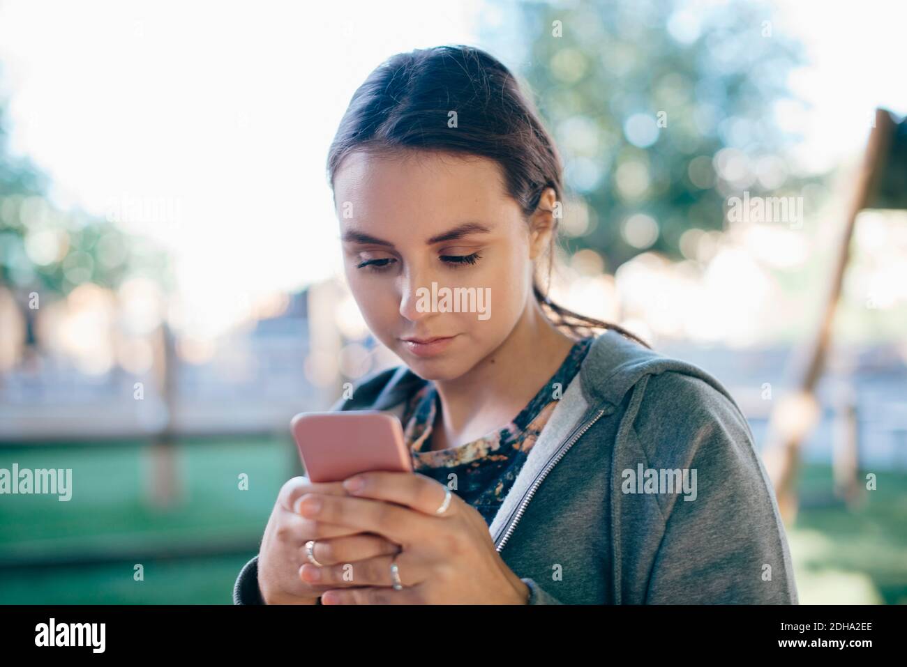 Young woman using smart phone Stock Photo