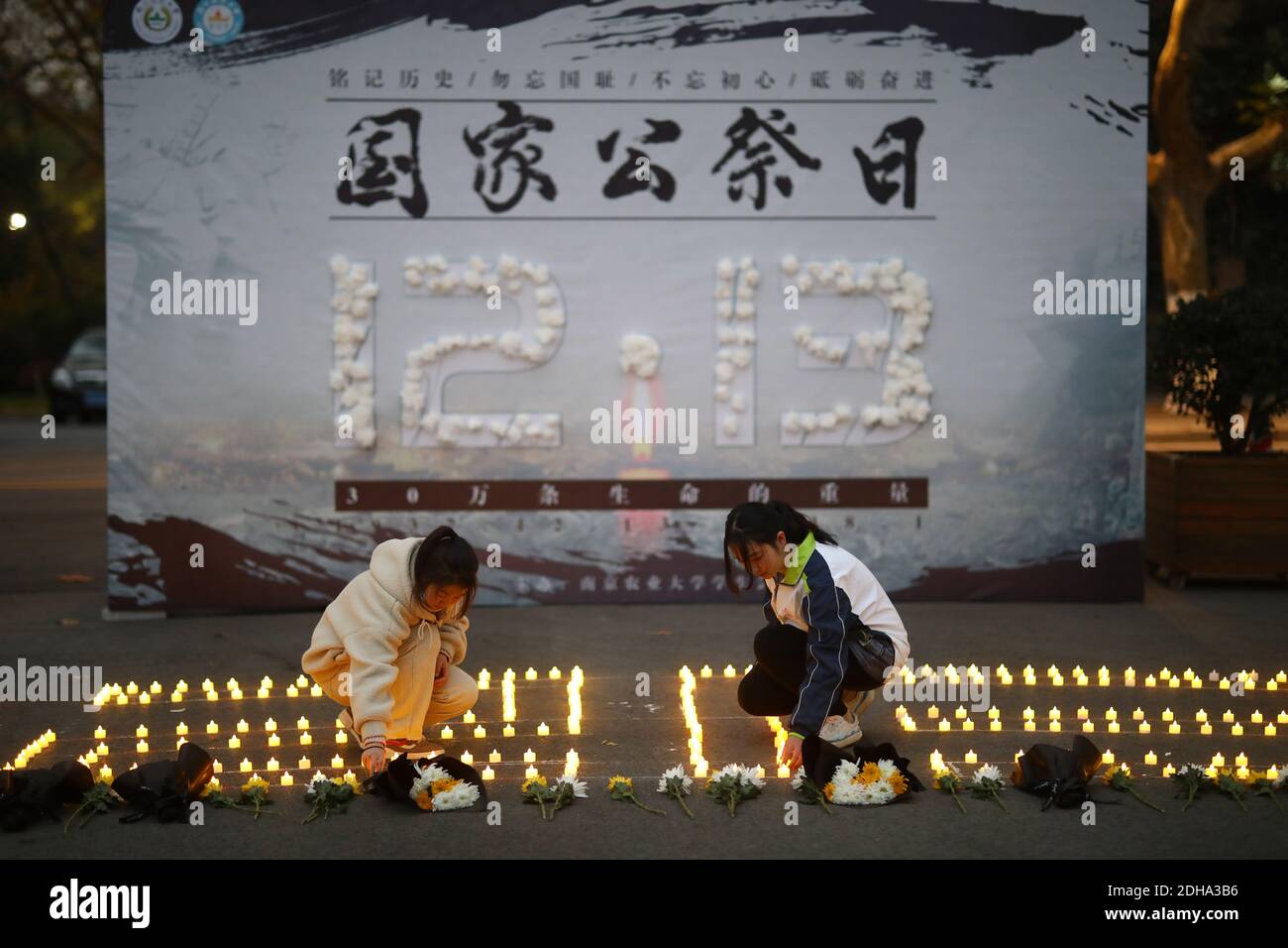 Nanjing, China. 09th Dec, 2020. The college students mourn Nanjing Massacre Victims at the National Memorial Day in Nanjing, Jiangsu, China on December 9, 2020. (Photo by Top Photo/Sipa USA) Credit: Sipa USA/Alamy Live News Stock Photo