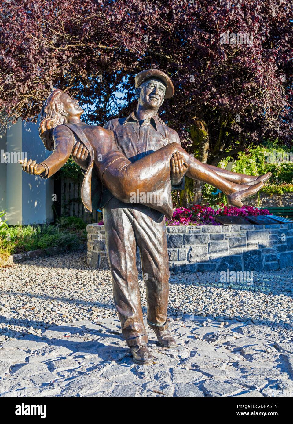 The Quiet Man statue, Cong, County Mayo, Connemara, Republic of Ireland. Eire. The statue is based on the theatrical release poster for the film and s Stock Photo
