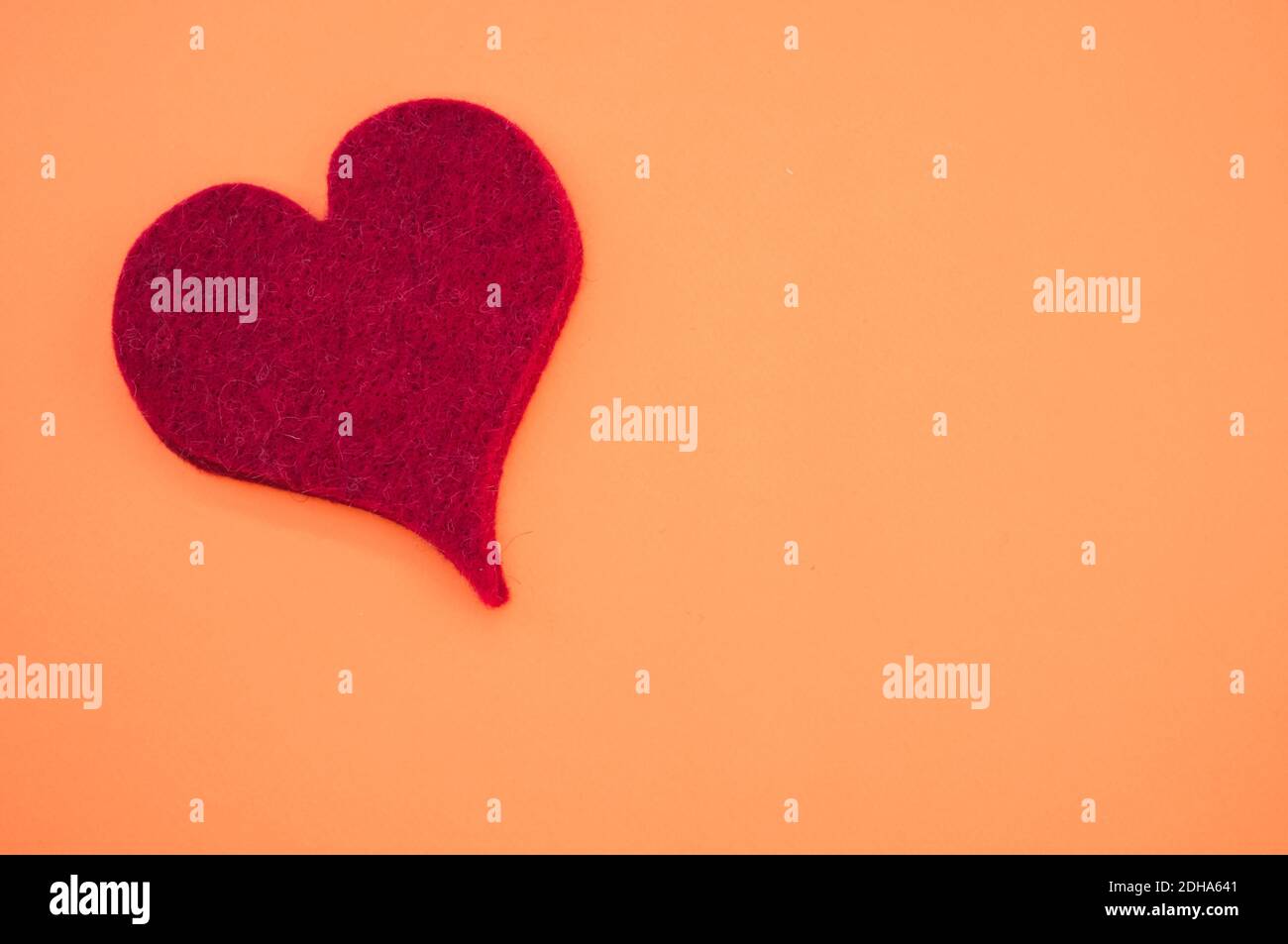 A top view of a red heart on orange background for a copy space Stock ...