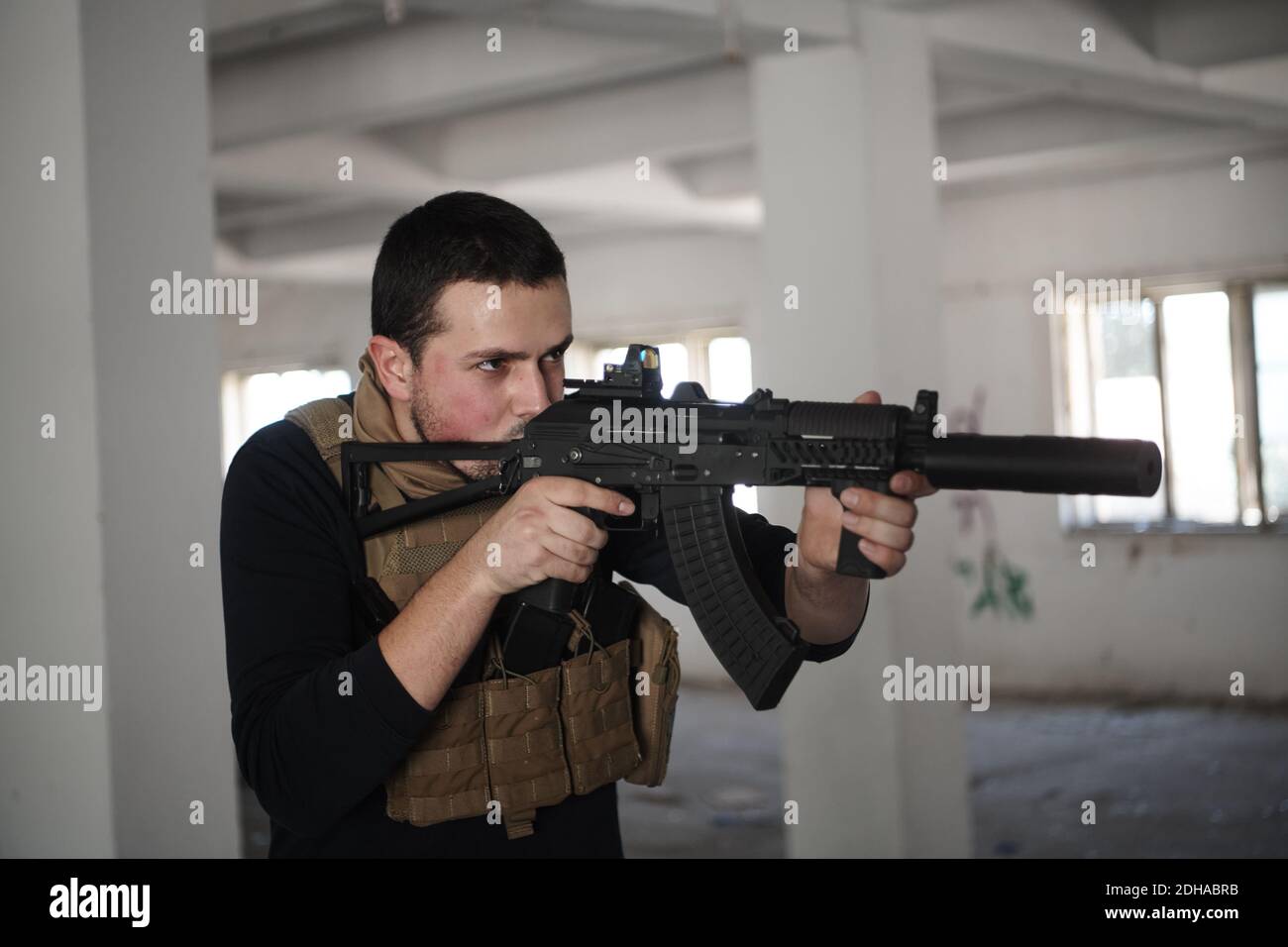 Special agent soldier aiming wearing casual clothing Stock Photo - Alamy