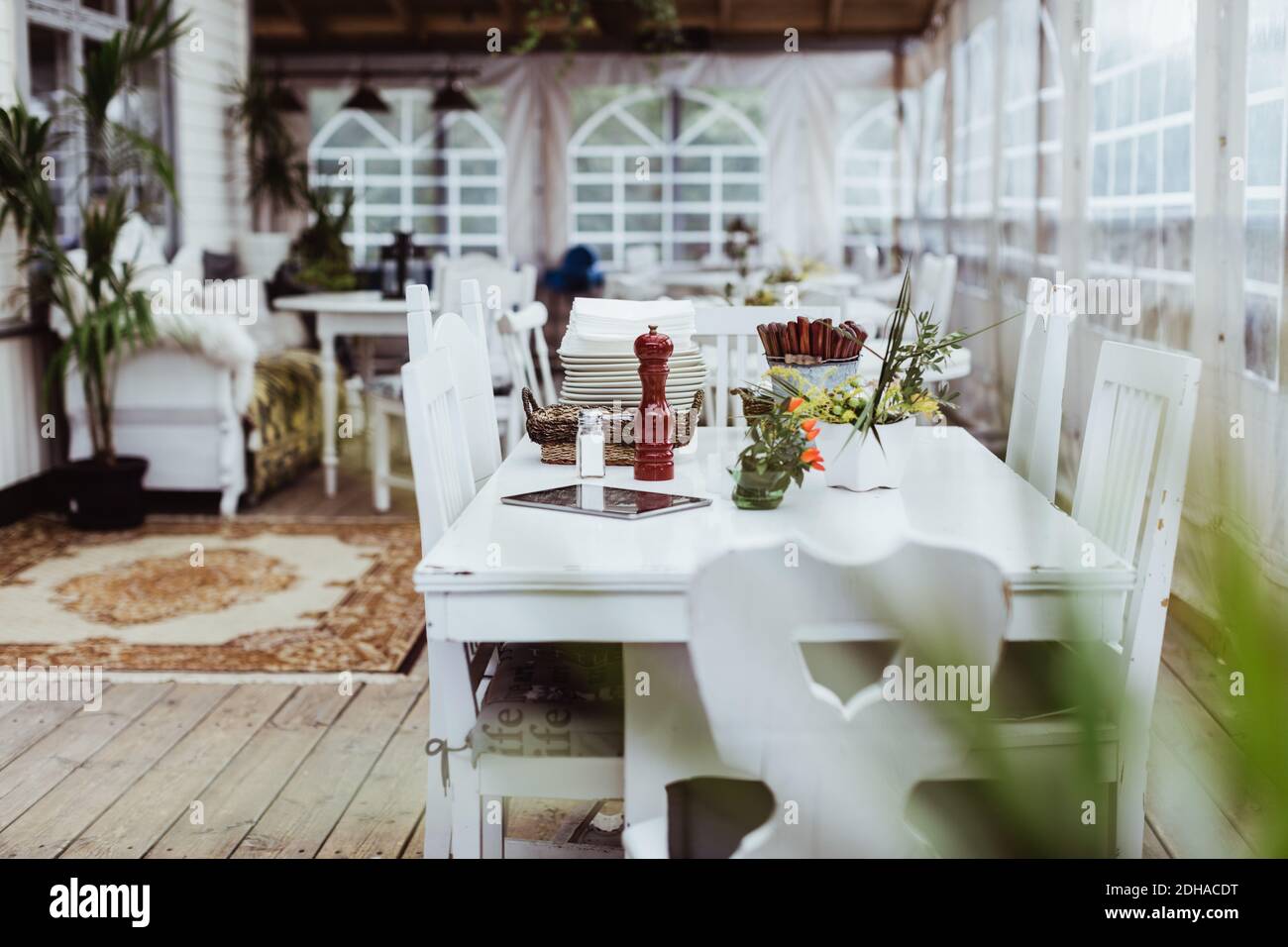 Empty chair and tables in restaurant Stock Photo