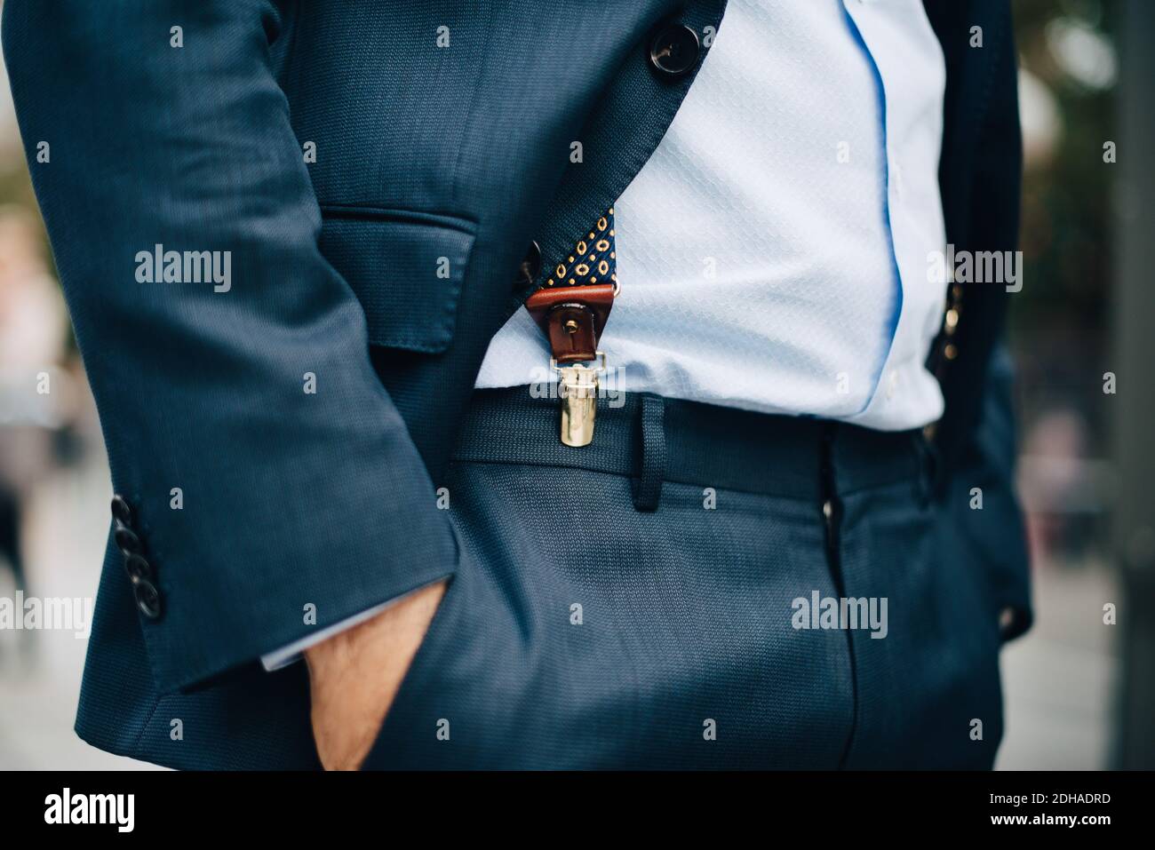 Midsection of businessman standing with hand in pocket Stock Photo