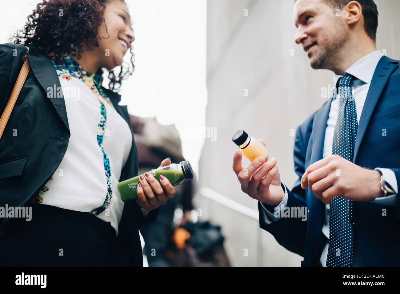 Two men holding up bottles hi-res stock photography and images - Alamy