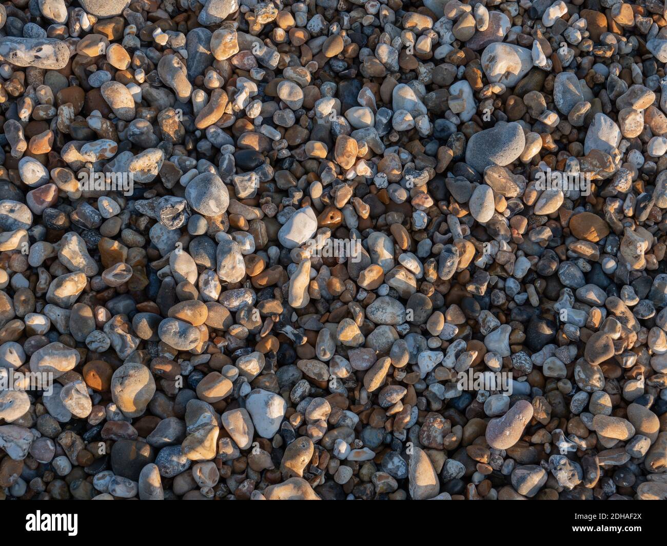Pebbles and cobbles seen in a close up Stock Photo Alamy