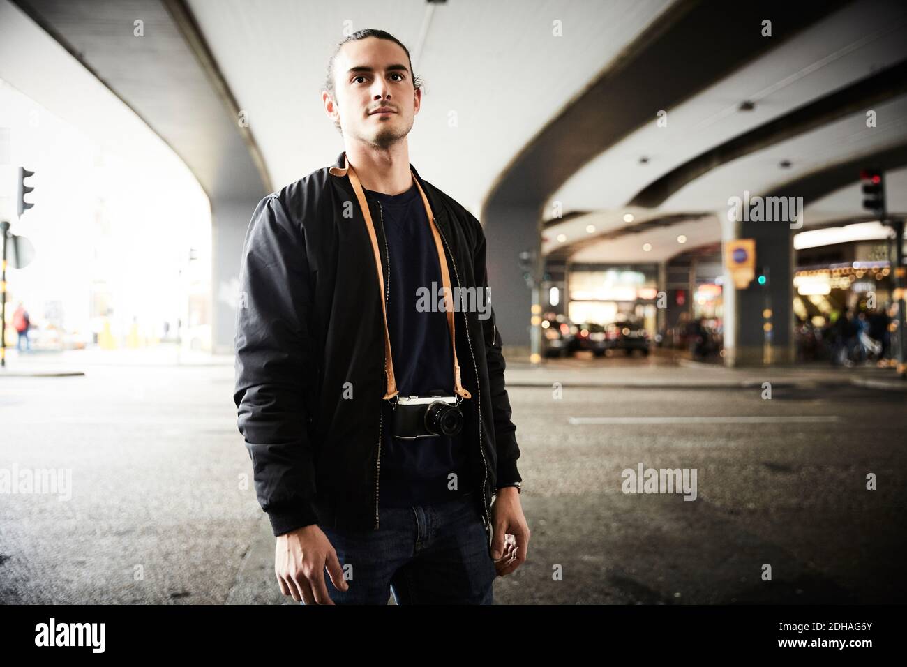 Young man standing in the street hi-res stock photography and images ...