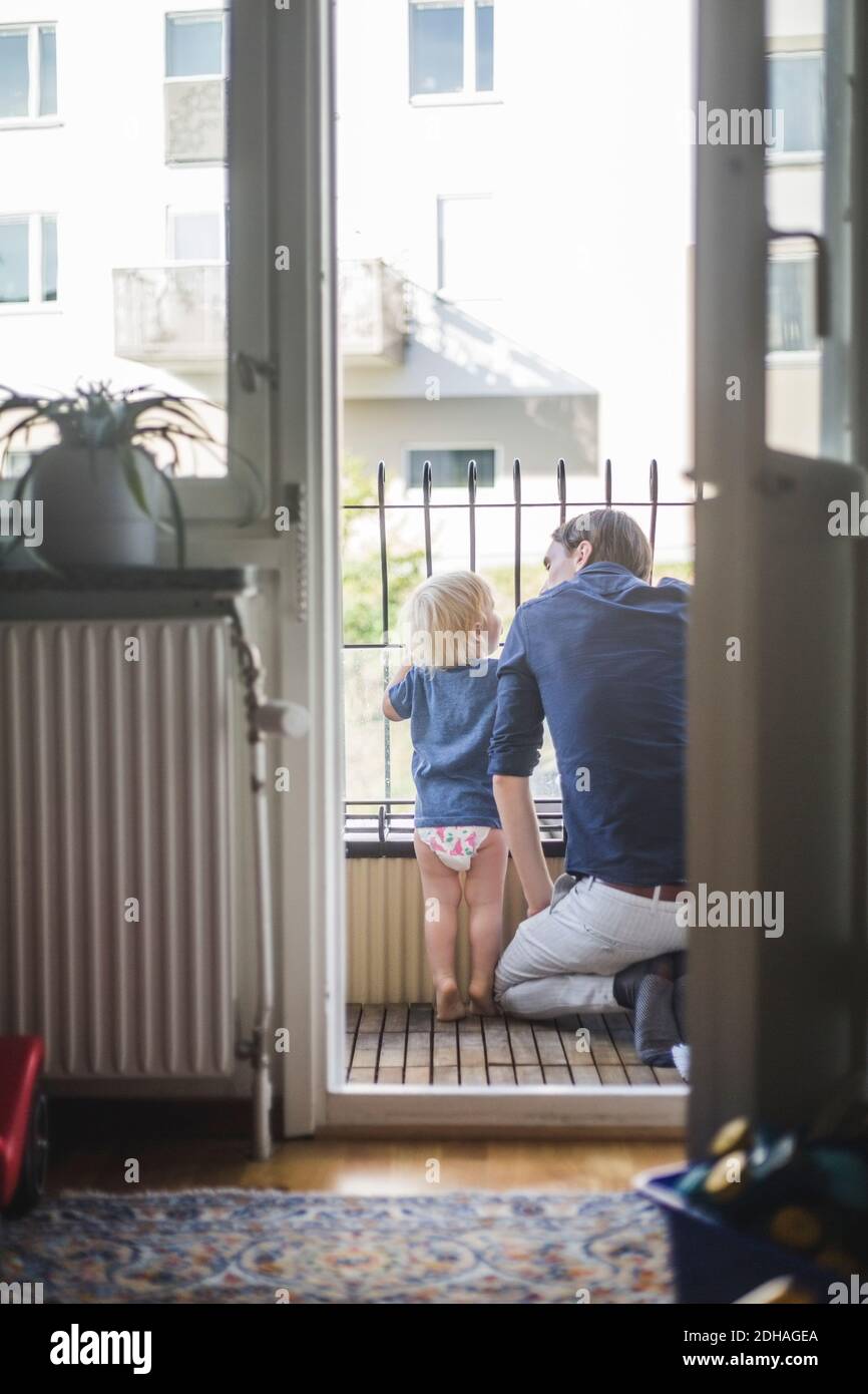 Child kneeling rear view hi-res stock photography and images - Alamy