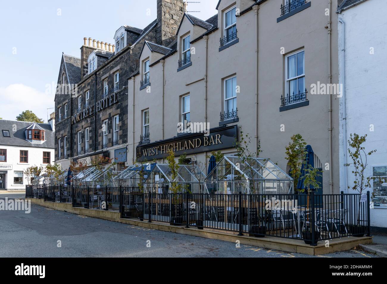 Greenhouses used to provide social distancing for customers at the Portree Hotel, Portree, Isle of Skye, Scotland Stock Photo