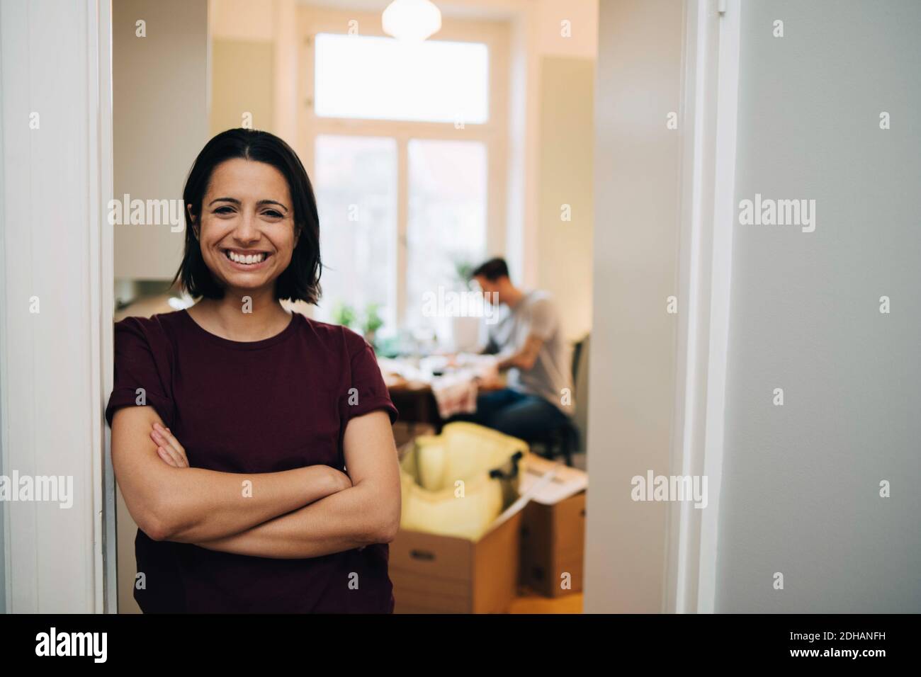 Woman standing at doorway of house hi-res stock photography and images ...