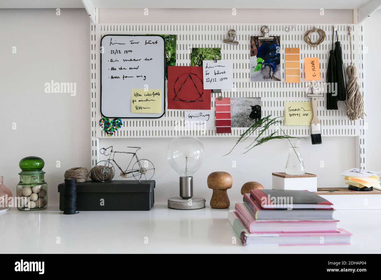 Reminders on pegboard in home office Stock Photo