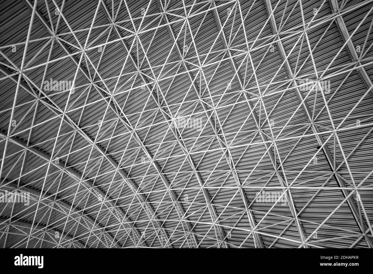 Modern interior architecture of metal steel roof structure of airport or industrial factory. Stock Photo