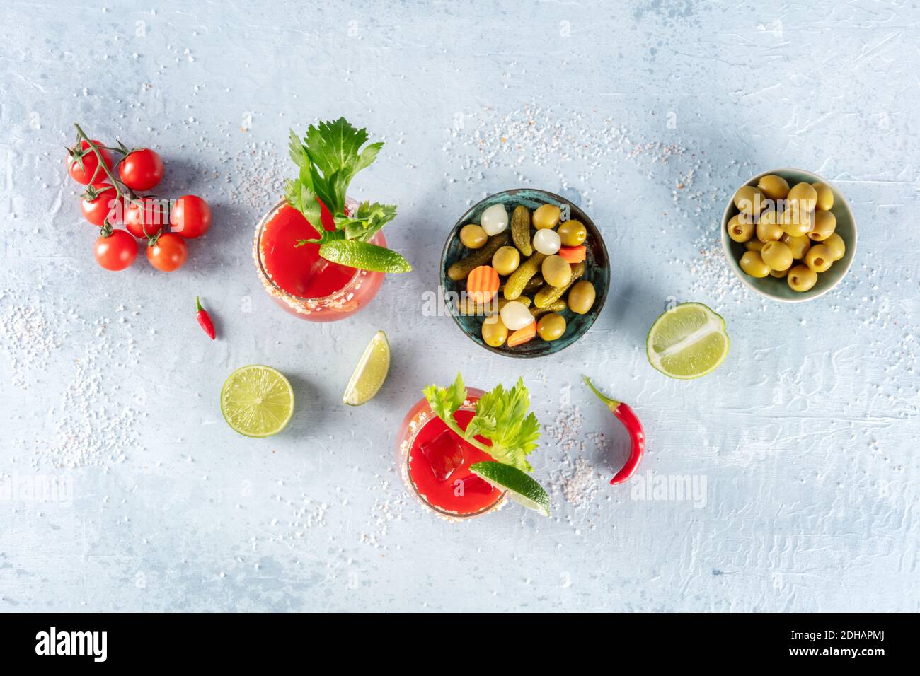 Bloody Mary cocktails, shot from the top. Tomato juice mix with celery