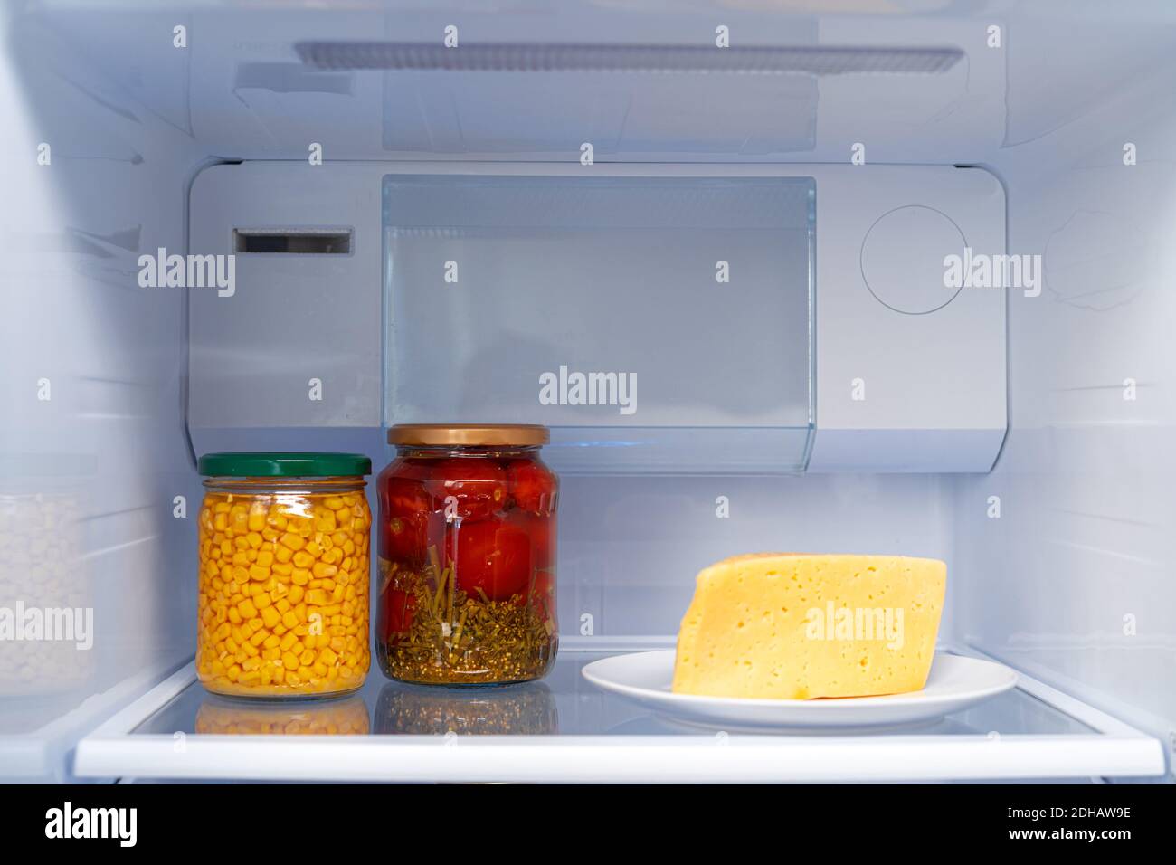Glass jars of canned products on a fridge shelf Stock Photo Alamy