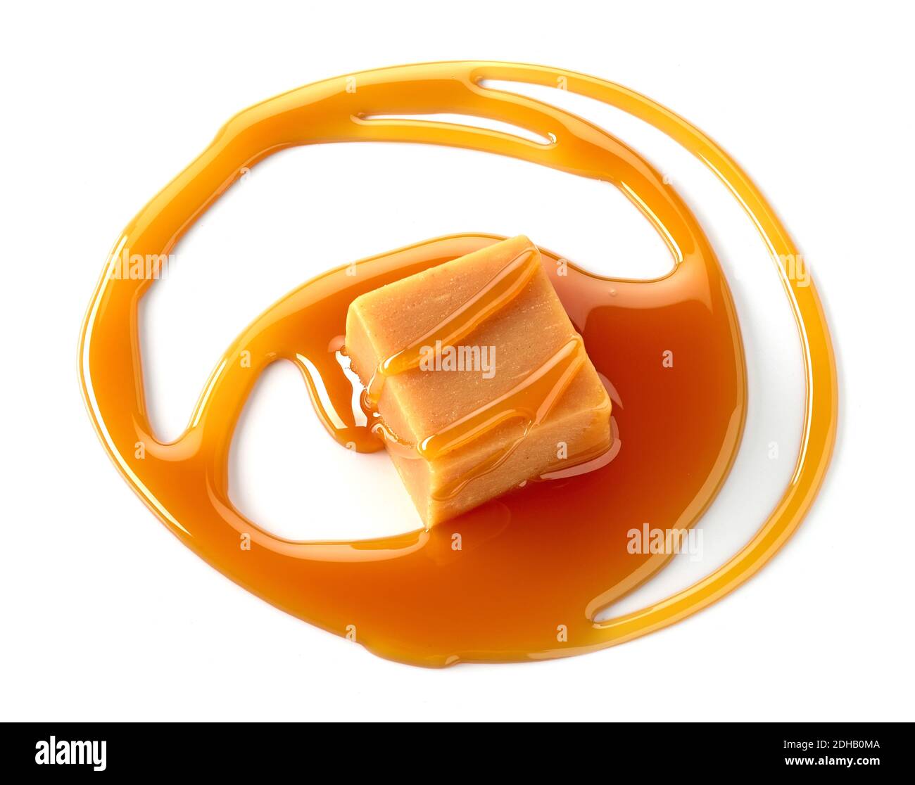 caramel candy and melted caramel sauce isolated on white background