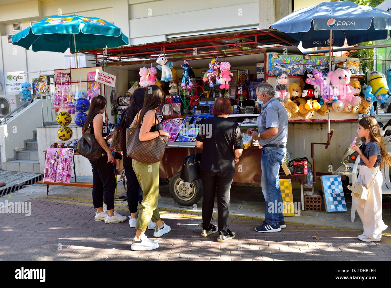 Street vendor selling toys and games in tourist town Stock Photo
