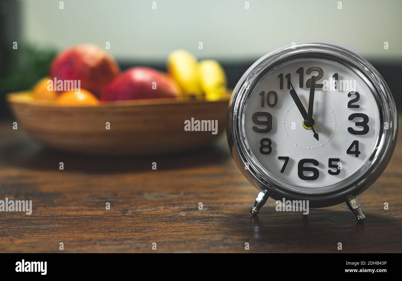 The clock shows eleven o'clock in the afternoon Stock Photo Alamy