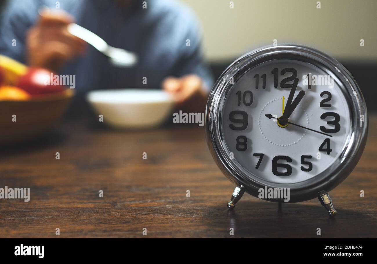 The clock shows one o'clock. Lunch time Stock Photo - Alamy