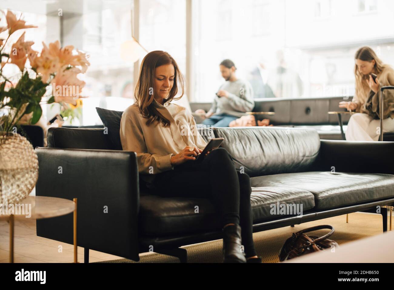 Lifestyle woman on sofa luxury hi-res stock photography and images - Alamy
