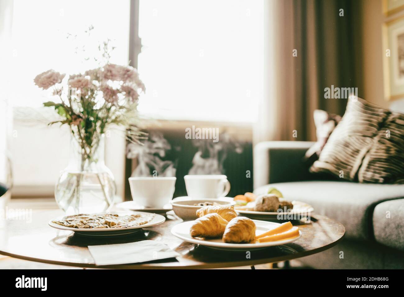 Breakfast served on table in hotel room Stock Photo