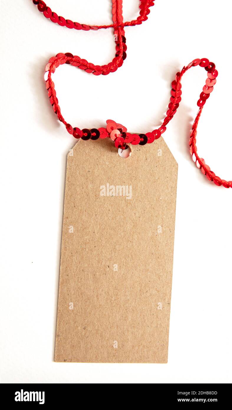 Blank brown cardboard gift tag, Carton paper label isolated on white