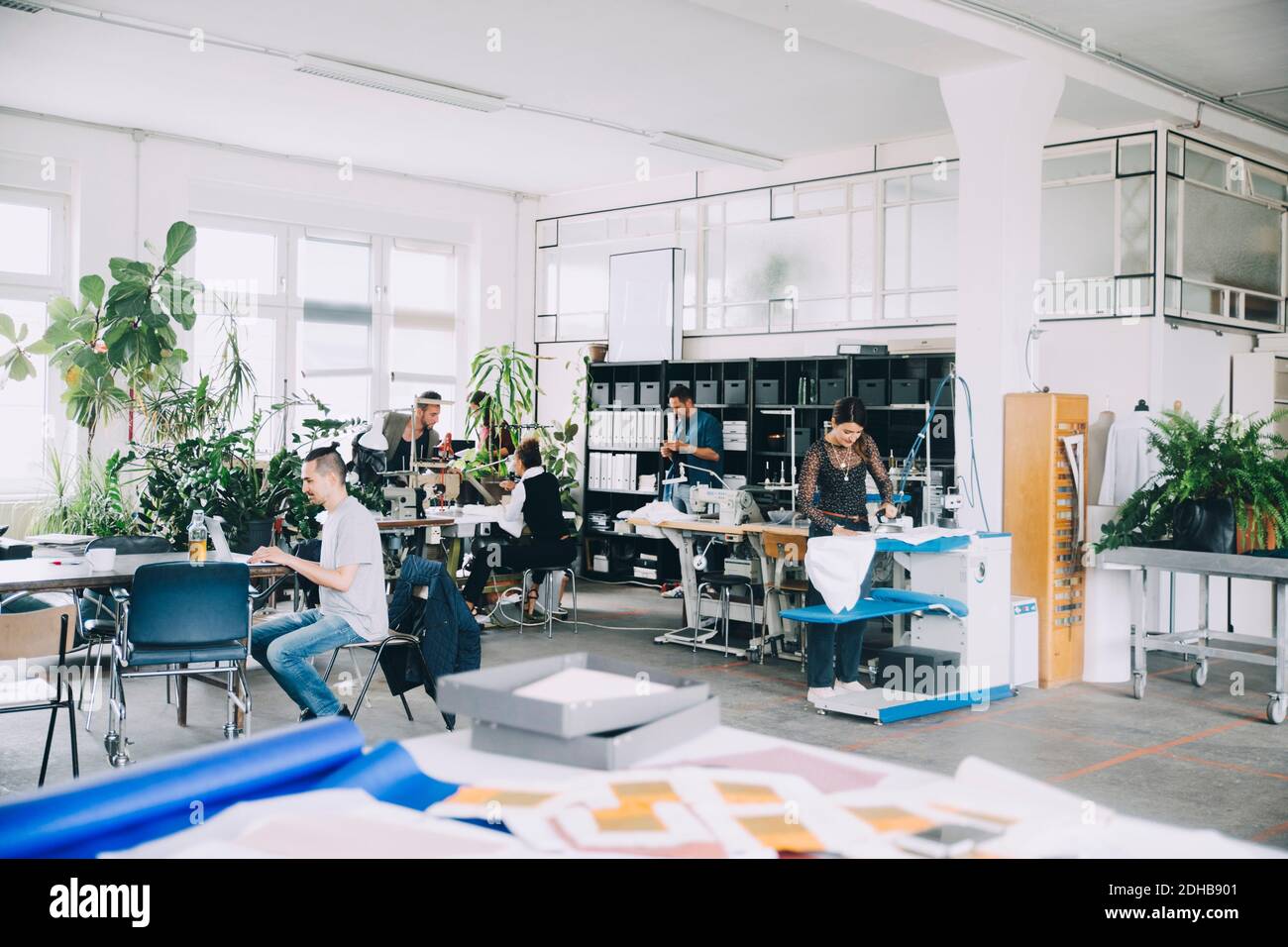 Entrepreneurs working in new office hi-res stock photography and images ...