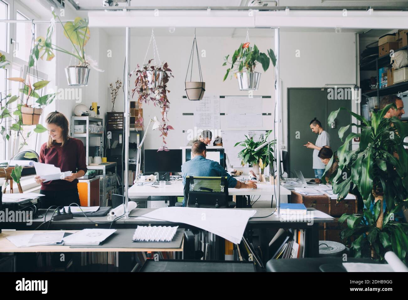 Male and female professionals working in creative office Stock Photo