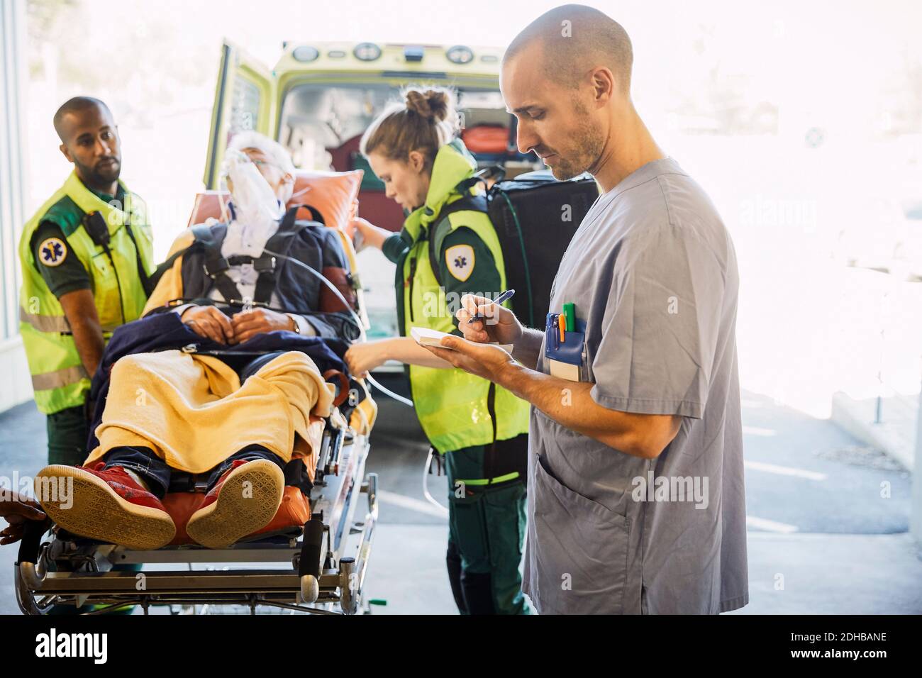Paramedics pushing patient on gurney hi res stock photography and