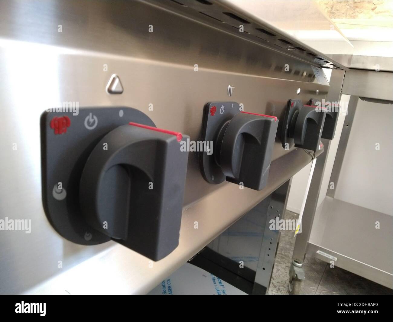 Commercial kitchen stove temperature controls Stock Photo Alamy