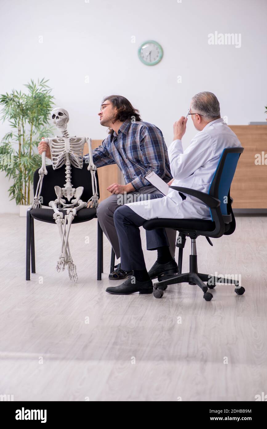 Young male patient visiting experienced doctor psychiatrist Stock Photo