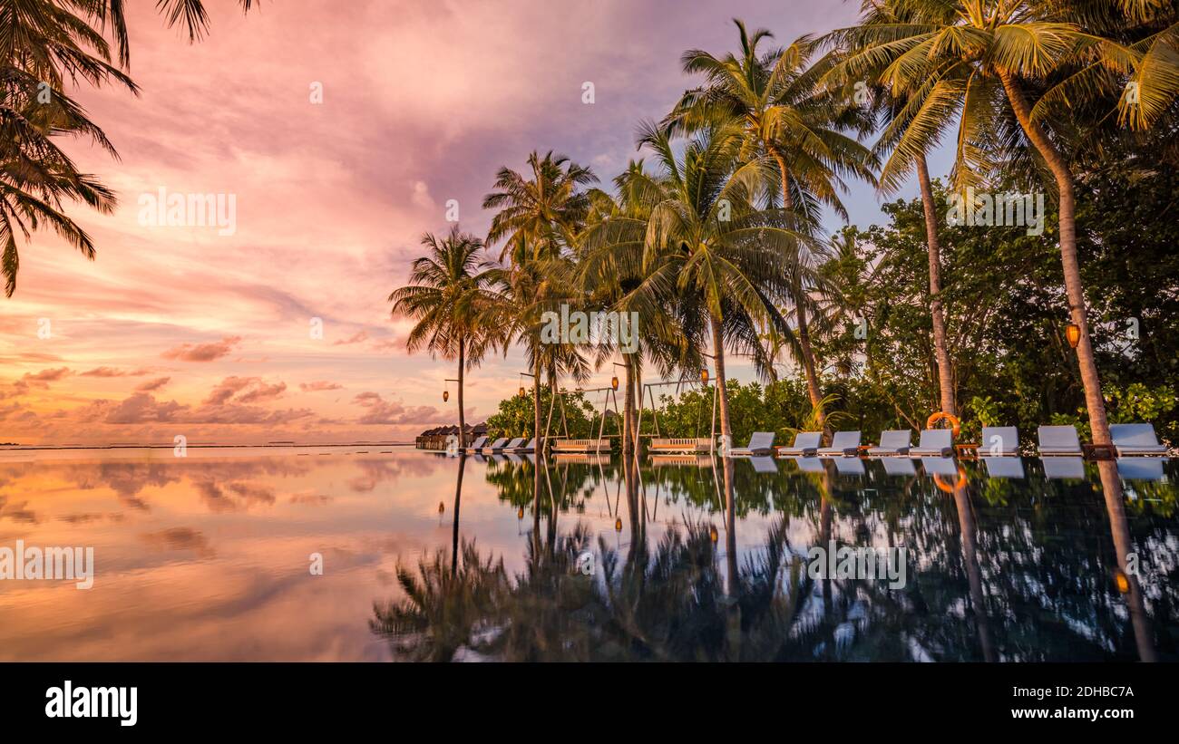 Picture of Beautiful poolside and sunset sky. Luxurious tropical beach, infinity ...
