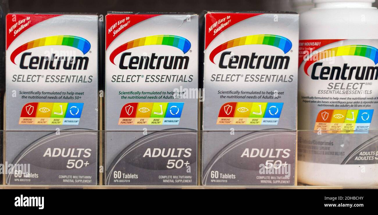 Centrum vitamins bottles stacked on the pharmacy's shelf Stock Photo