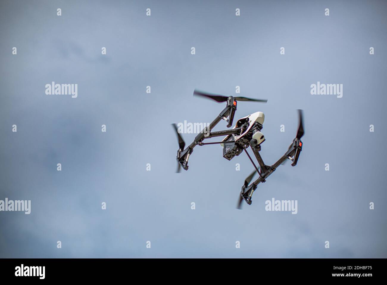 Flying drone on the sky. Drone with high resolution digital camera, photography and video, aerial view Stock Photo