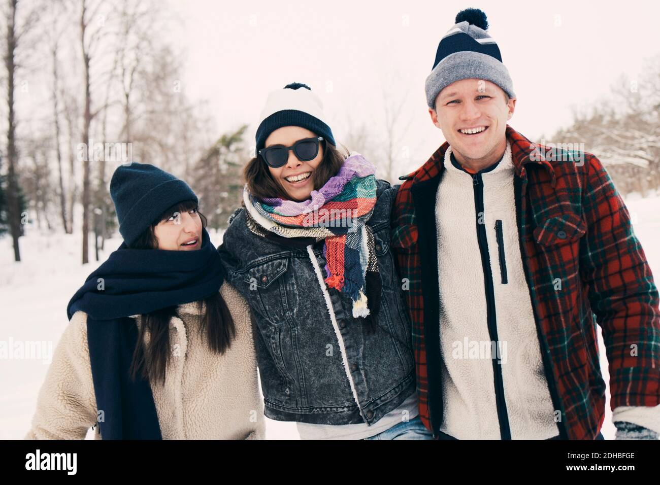Happy friends enjoying at park during winter Stock Photo