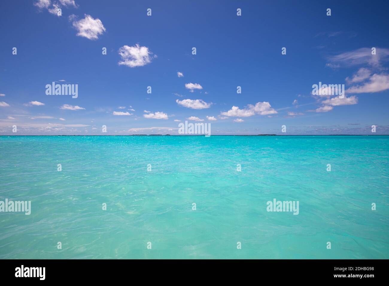 Perfect sky and water of ocean with endless view. Shades of blue, calm relaxing seascape and cloudy blue sky. Dream nature ecology concept, natural Stock Photo