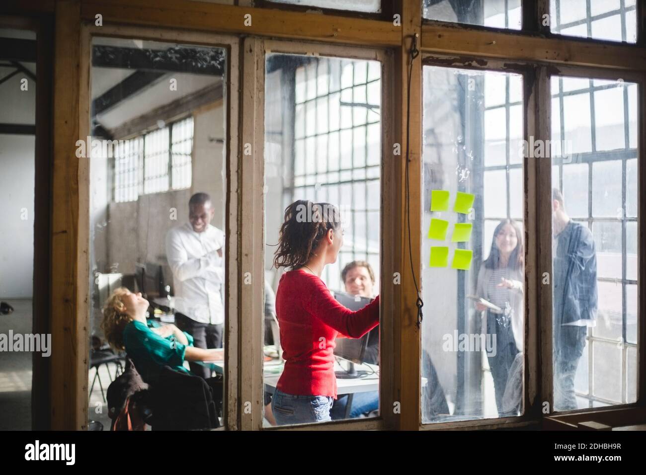 Team of computer programmers planning start-up strategy in board room ...