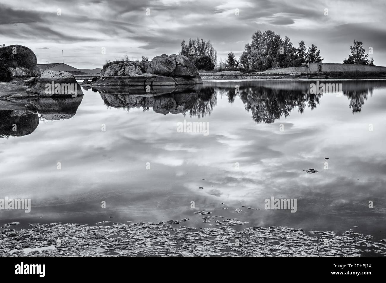 A grayscale of the pond in the natural area of the Barruecos, Spain Stock Photo