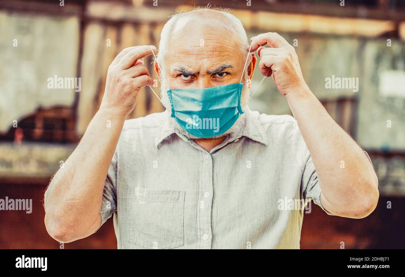 Old man wearing face mask. Portrait of an old man, years old, in a ...