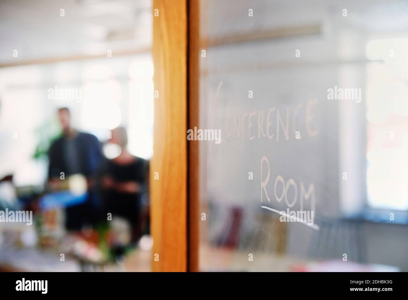 Conference room text on glass door in office Stock Photo