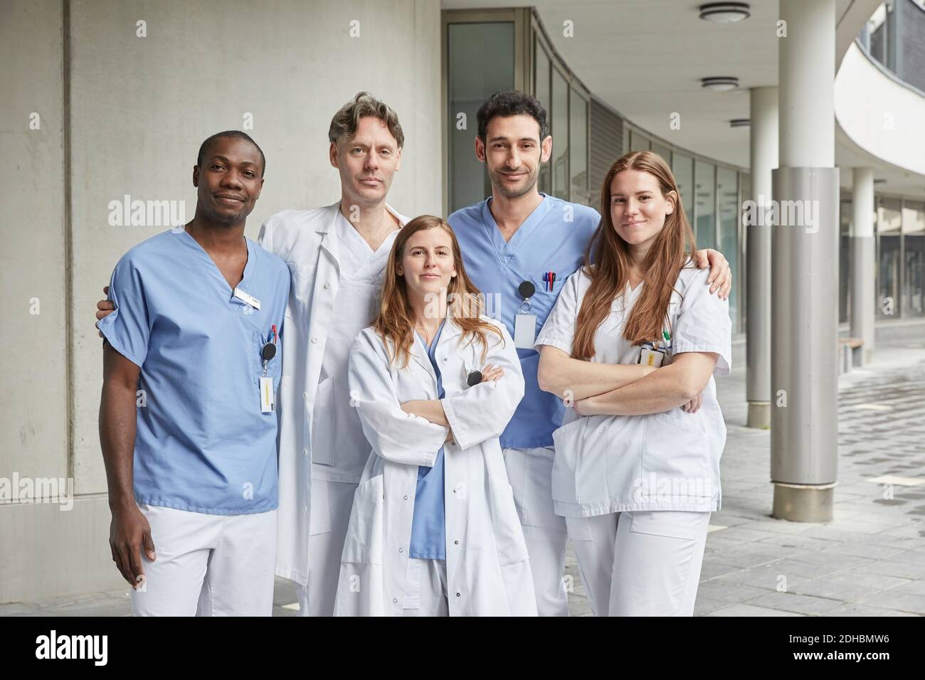 Portrait of confident multi-ethnic healthcare workers standing at ...