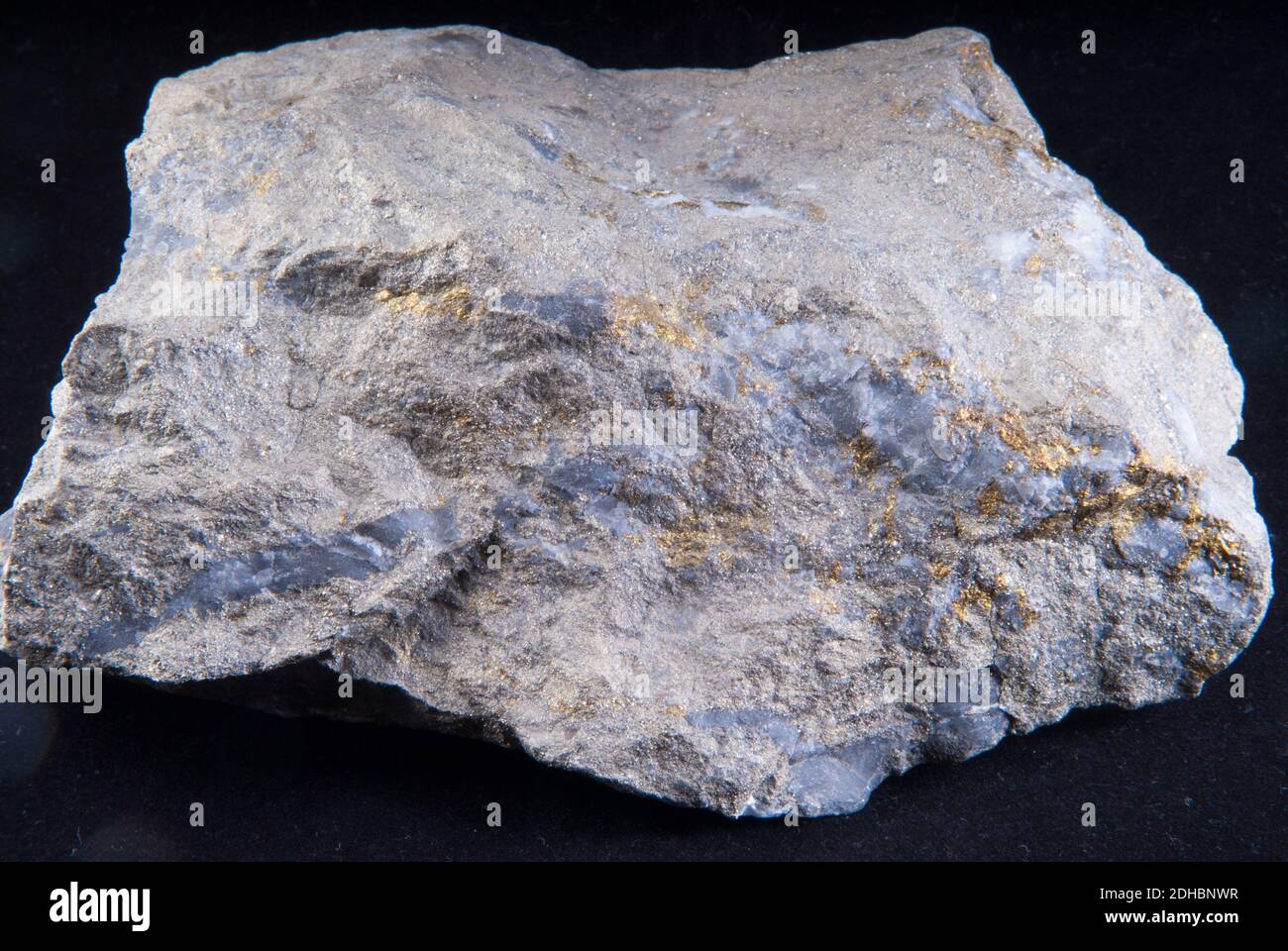ore sample of silver, copper and gold on a black background Stock Photo